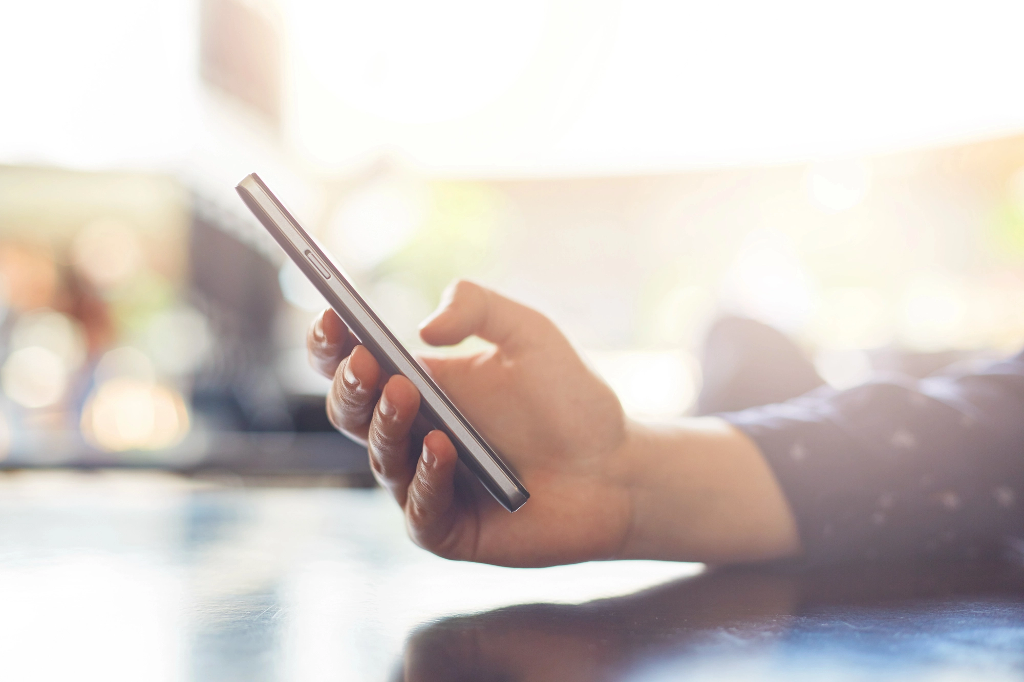 close-up of woman's hand holding smartphone