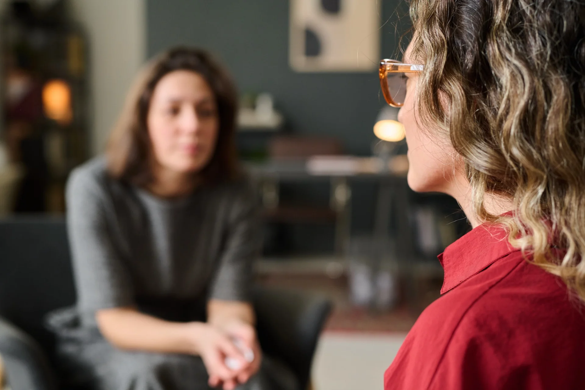 young woman talking to a counselor