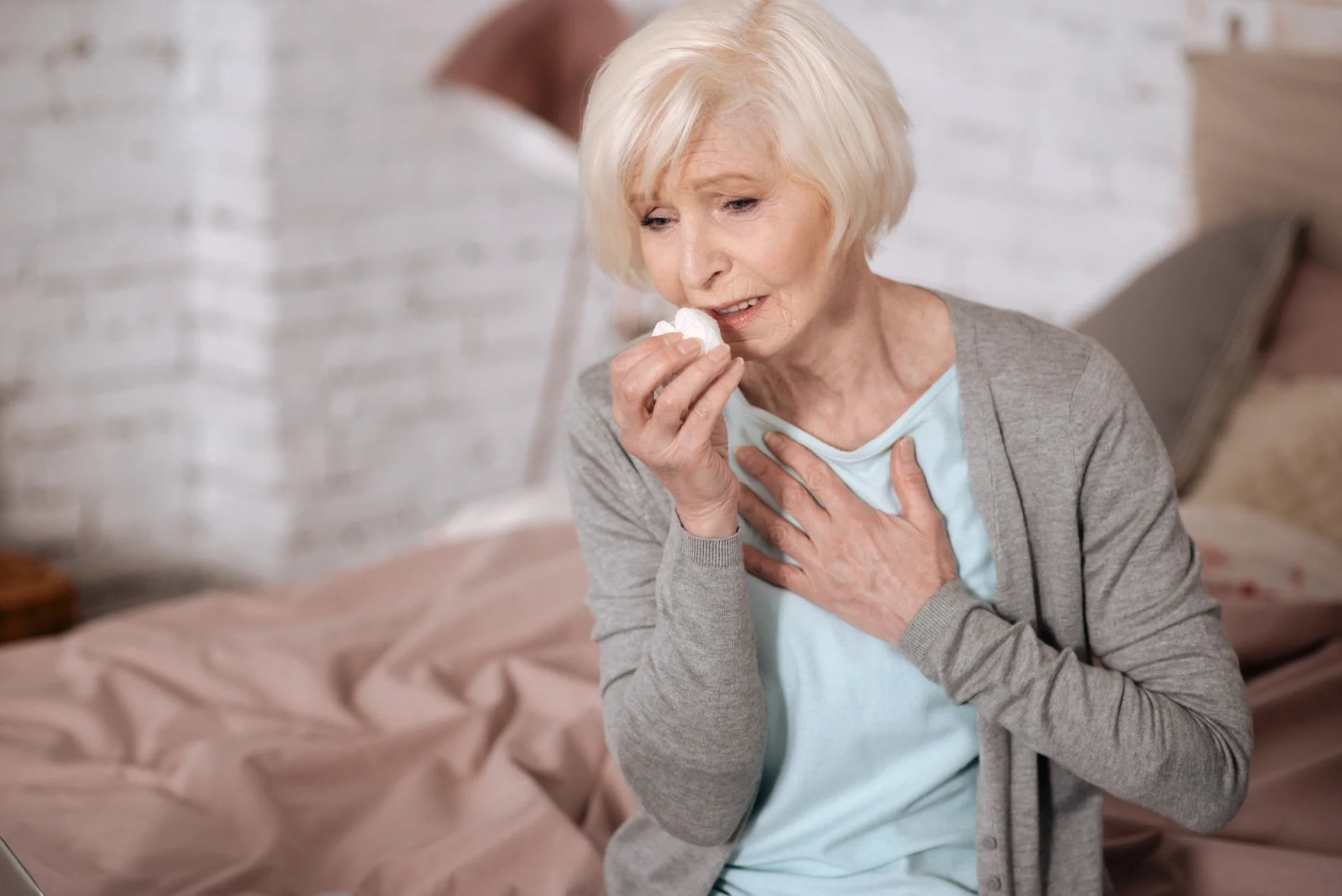 older woman coughing